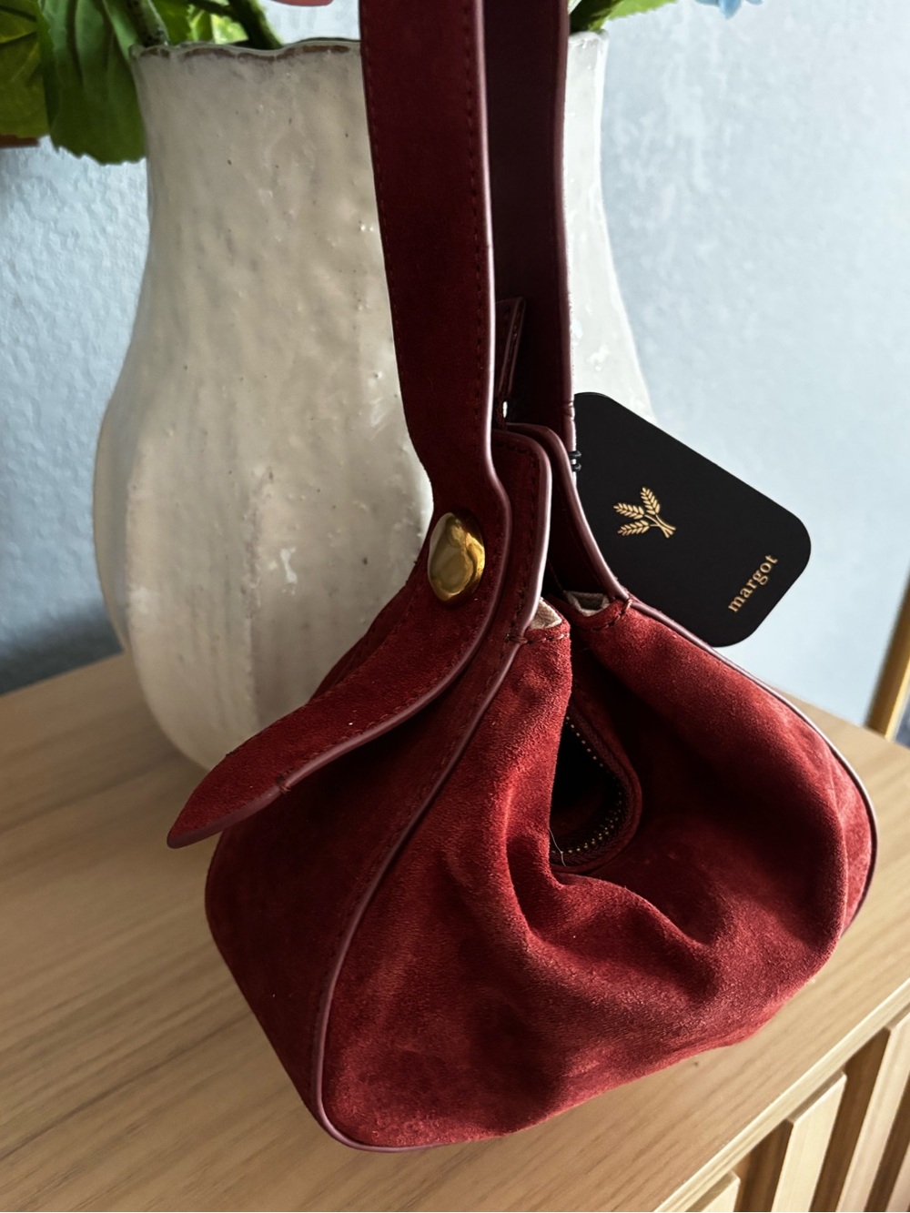 Margot suede wristlet in burgundy